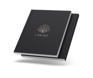 Closed I AWAKE journal with the eye cover and a thin coloured spine, on a transparent background.